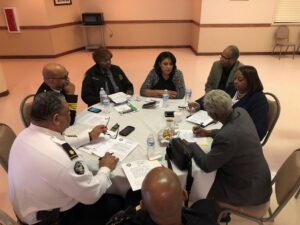 A group of people sitting around a table.
