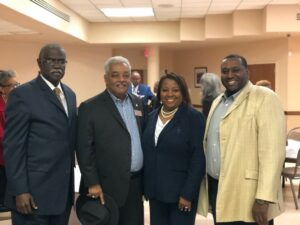 A group of people standing next to each other.