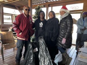 A group of people standing around each other.
