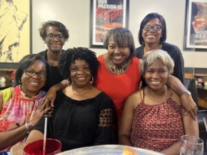 A group of women posing for a picture.