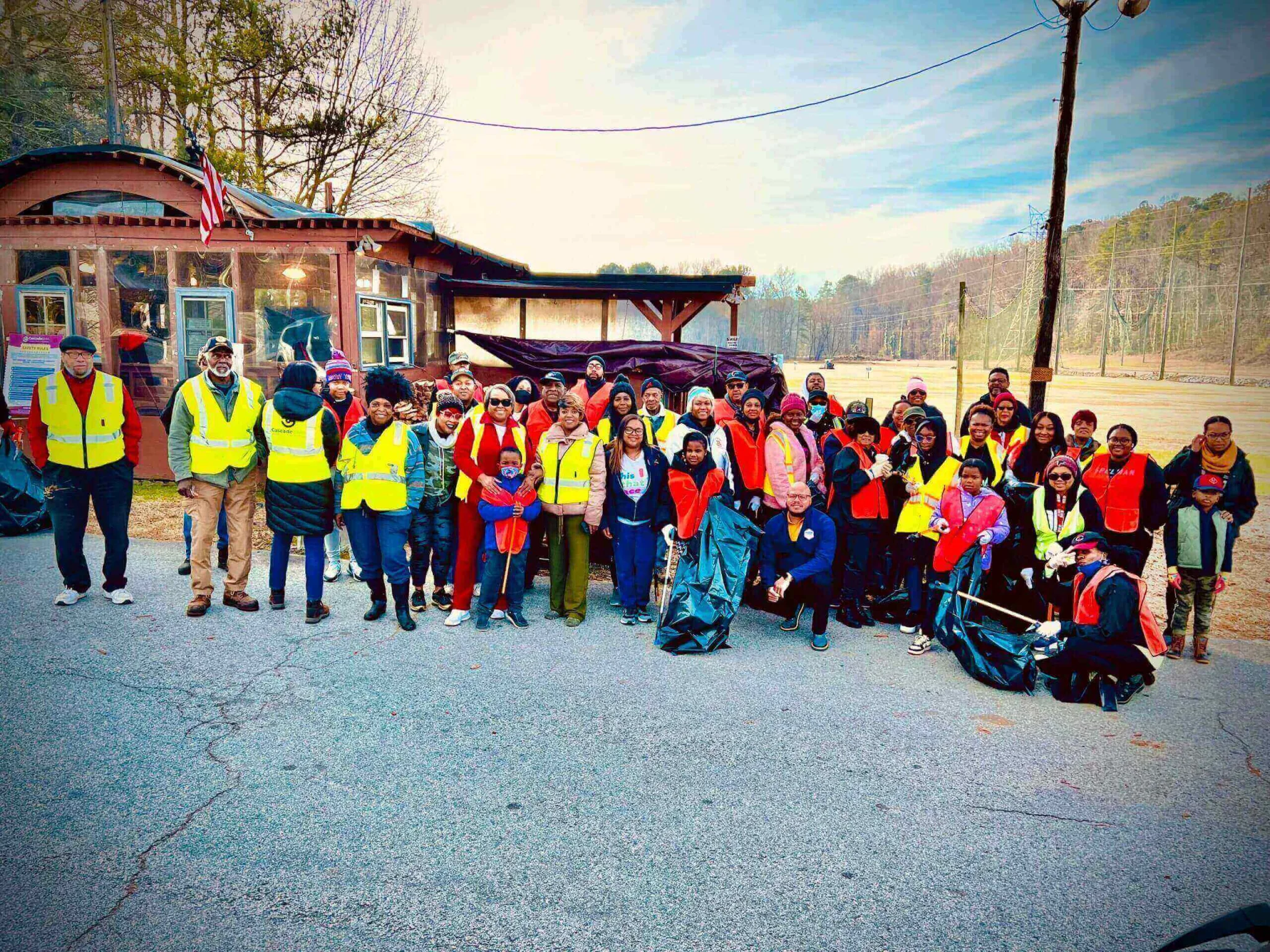 A group of people standing in the street.
